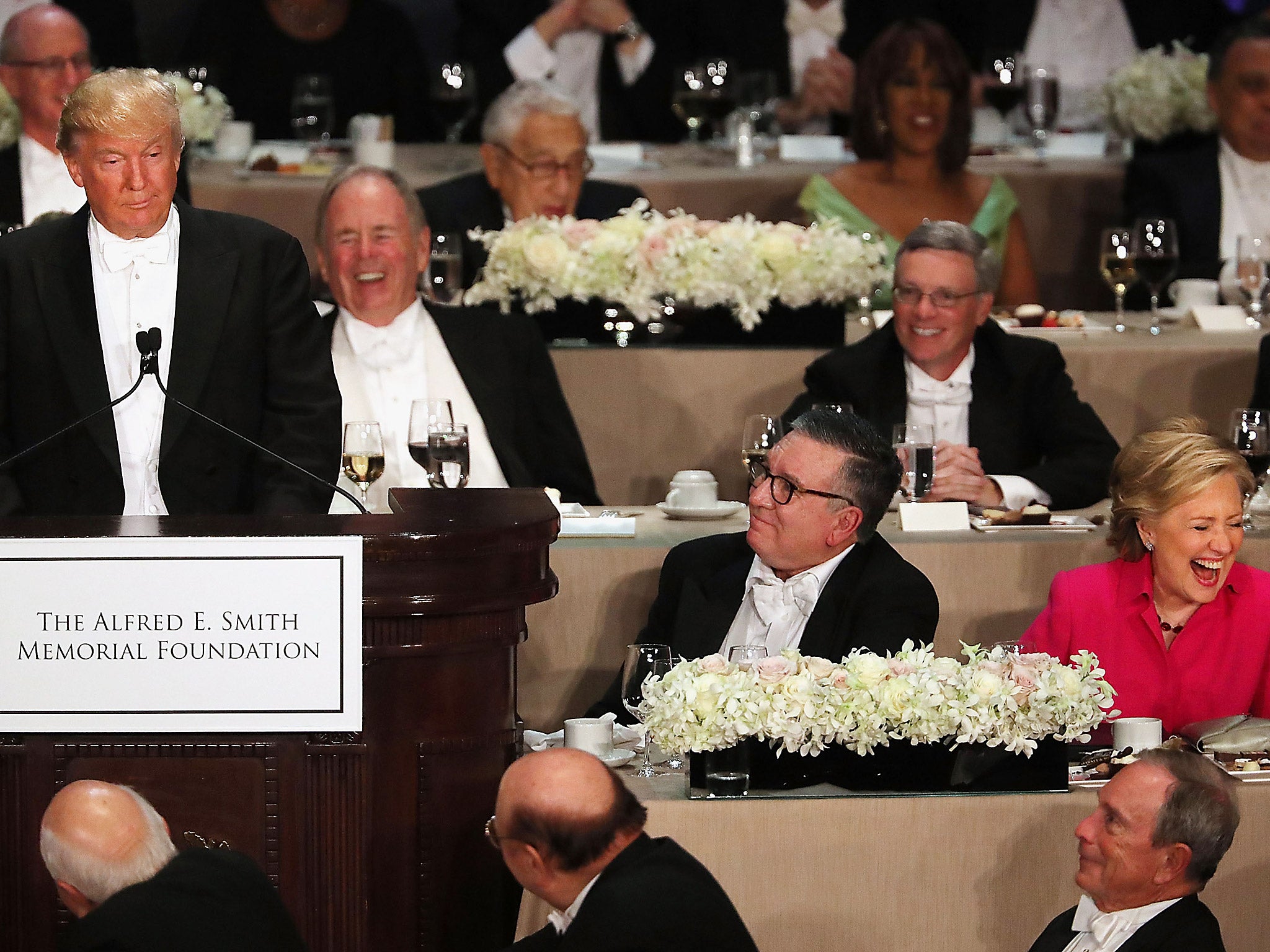 Hillary Clinton laughs as Donald Trump speaks at the annual Alfred E. Smith Memorial Foundation Dinner at the Waldorf Astoria