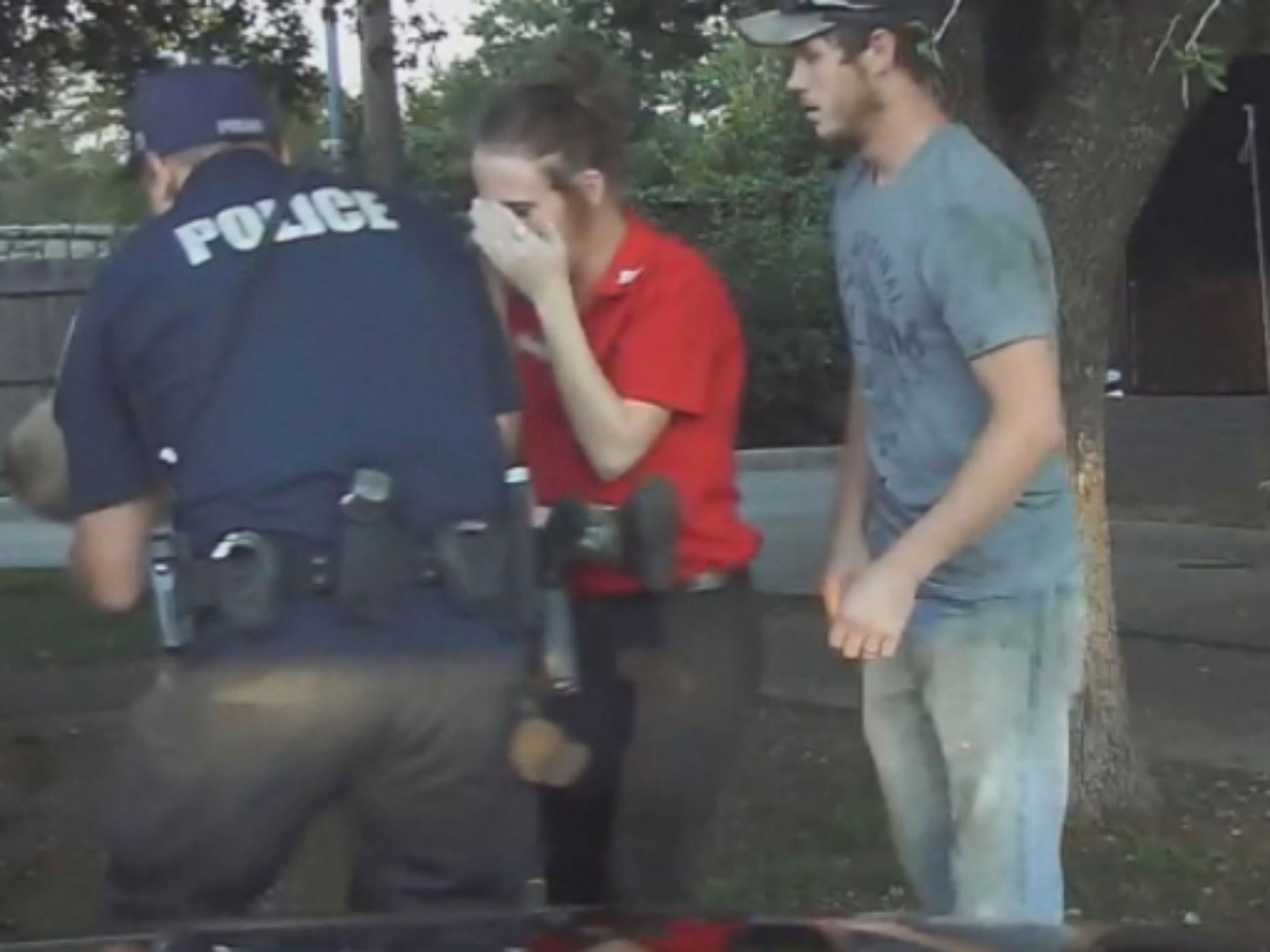 The parents watch with fear as officer Miller attempts CPR on their child