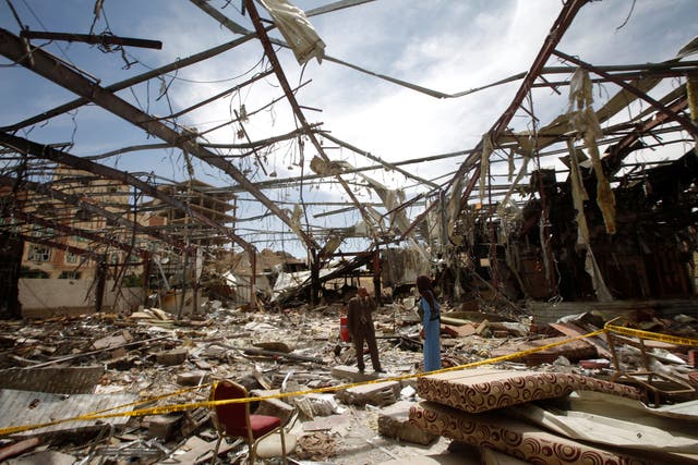 Member of the Specialised Criminal Prosecution Rajeh Zayed visits a community hall that was hit by an air strike during a funeral on October 8, in Sanaa, Yemen