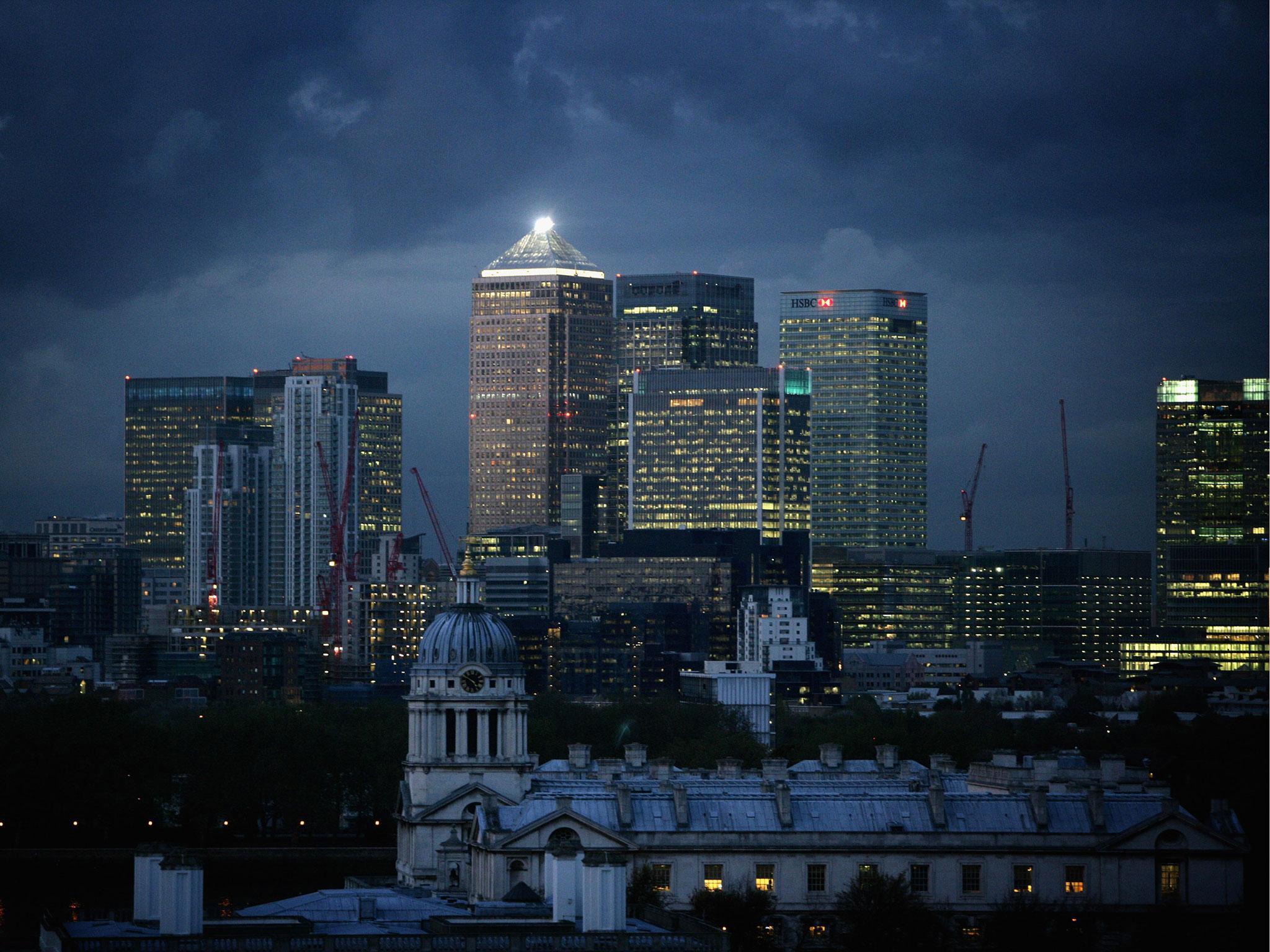 Clouds gather over high-rise buildings in Canary Wharf