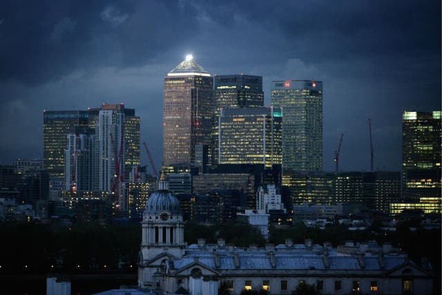 Clouds gather over high-rise buildings in Canary Wharf