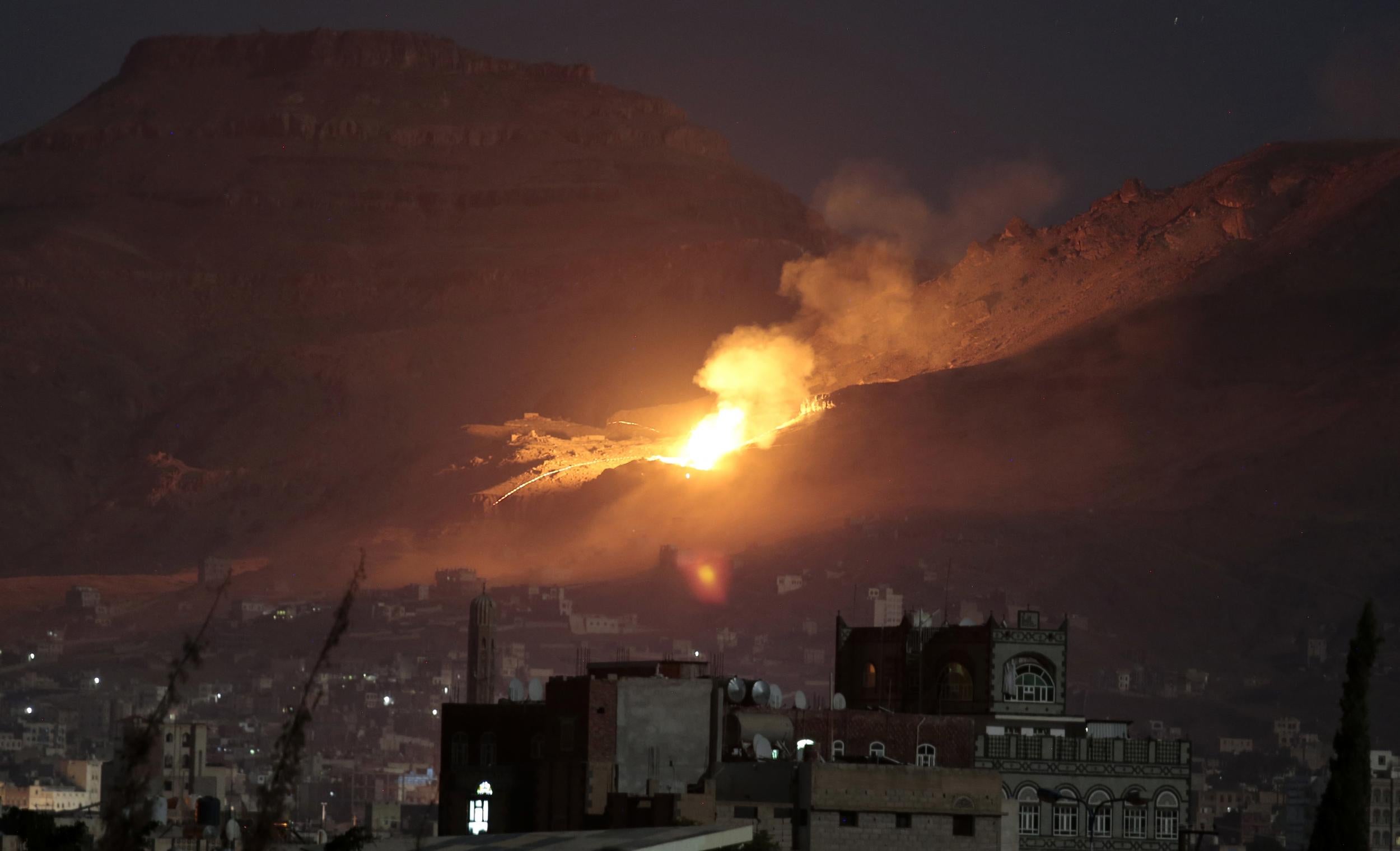 Fire and smoke rise after a Saudi-led air strike hit a weapons depot on the outskirts of Yemen's capital, Sana'a in October