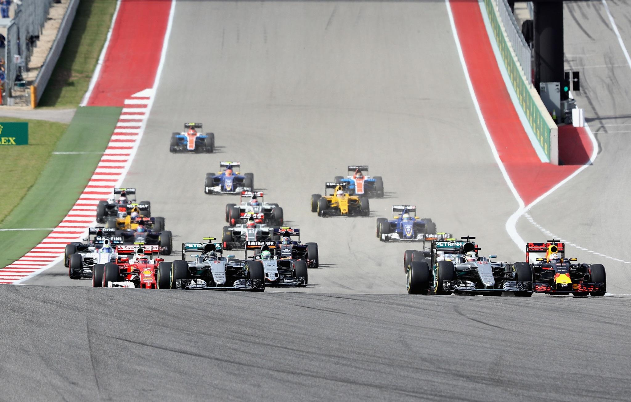 Lewis Hamilton leads the field into turn one of the US Grand Prix
