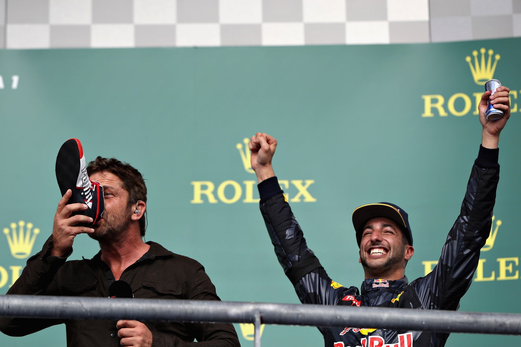 Gerard Butler drinks Red Bull out of Daniel Ricciardo's shoe