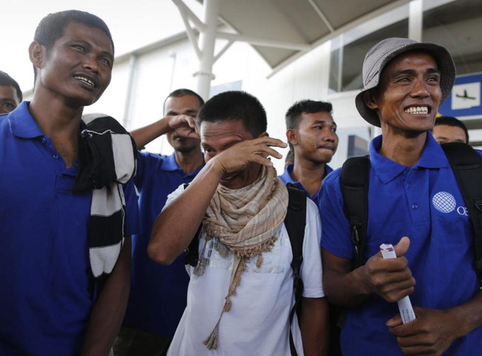 Sailors, including Arnel Balbero (R) react upon their arrival at the Jomo Kenyatta International Airport after they were released by Somali pirates, Nairobi, Kenya, 23 October, 2016