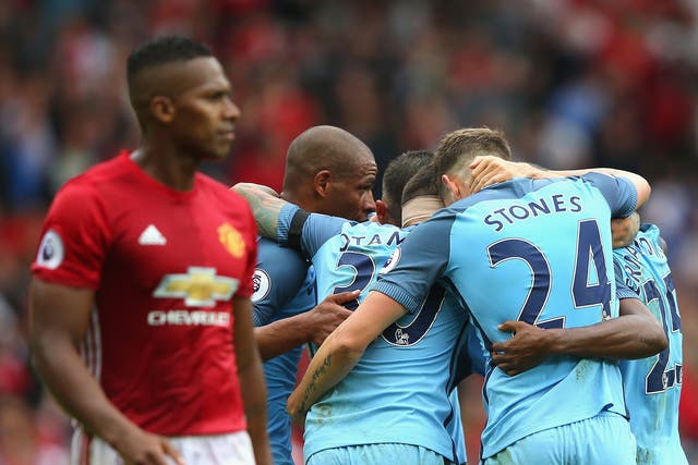 City celebrate their Premier League win at Old Trafford earlier this season