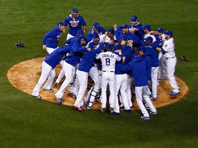 The Cub rush together to celebrate winning Game Six