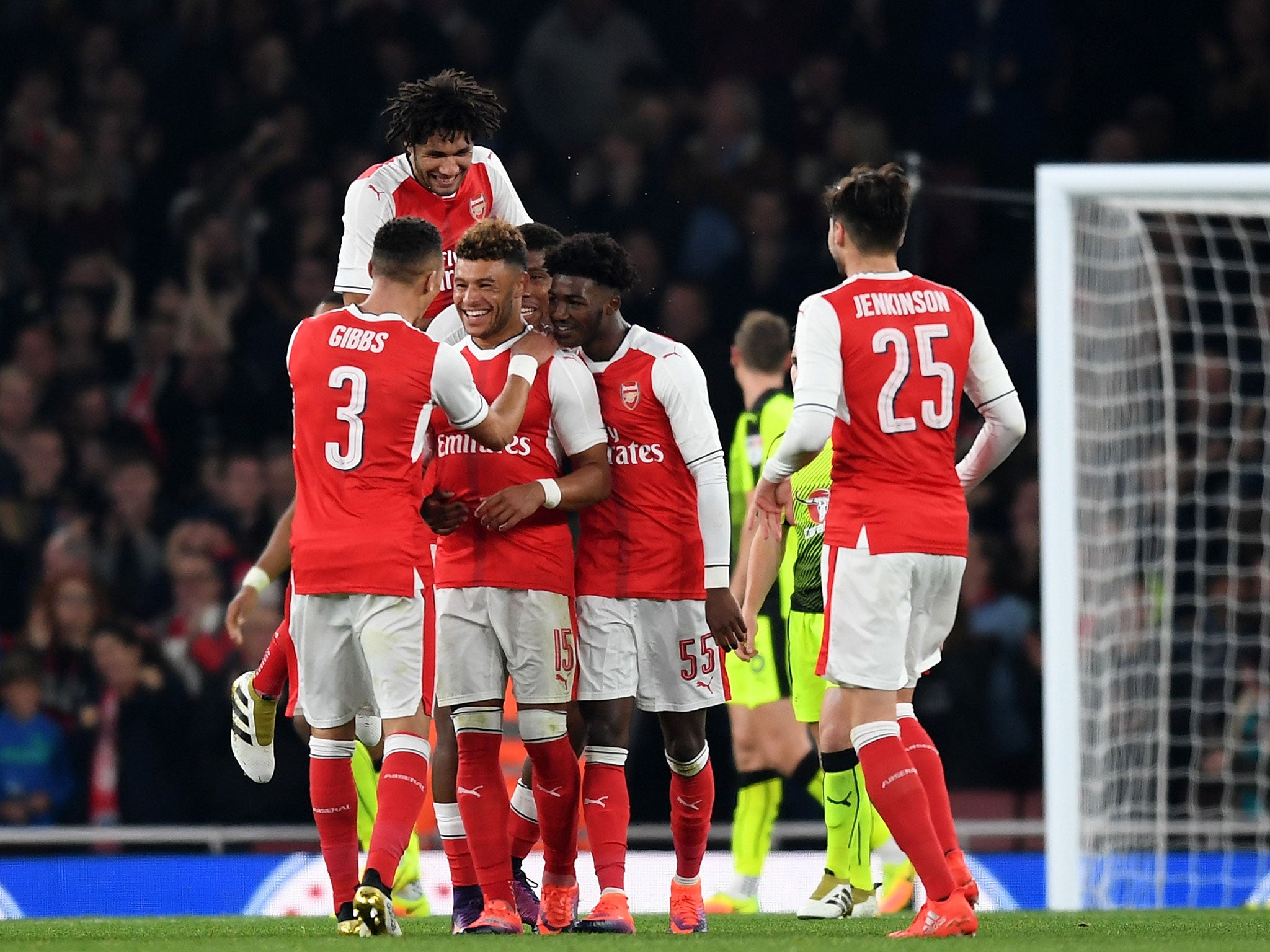 Alex Oxlade-Chamberlain is congratulated by his teammates after doubling Arsenal's lead