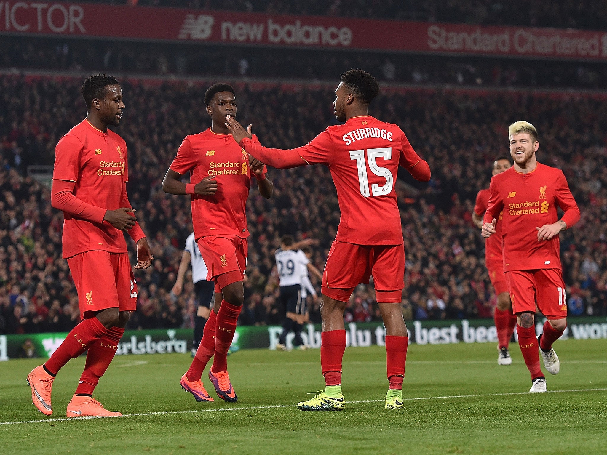 Daniel Sturridge celebrates his goal with teammates