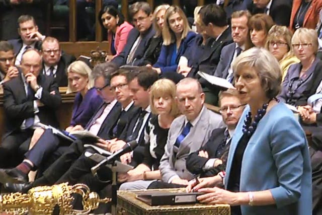 Theresa May speaks during Prime Minister's Questions in the House of Commons, London