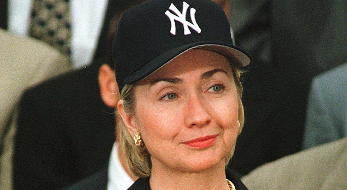 Hillary Clinton wears a New York Yankees baseball cap when the 1998 World Series winning Yankees were invited to the White House on June 10, 1999.