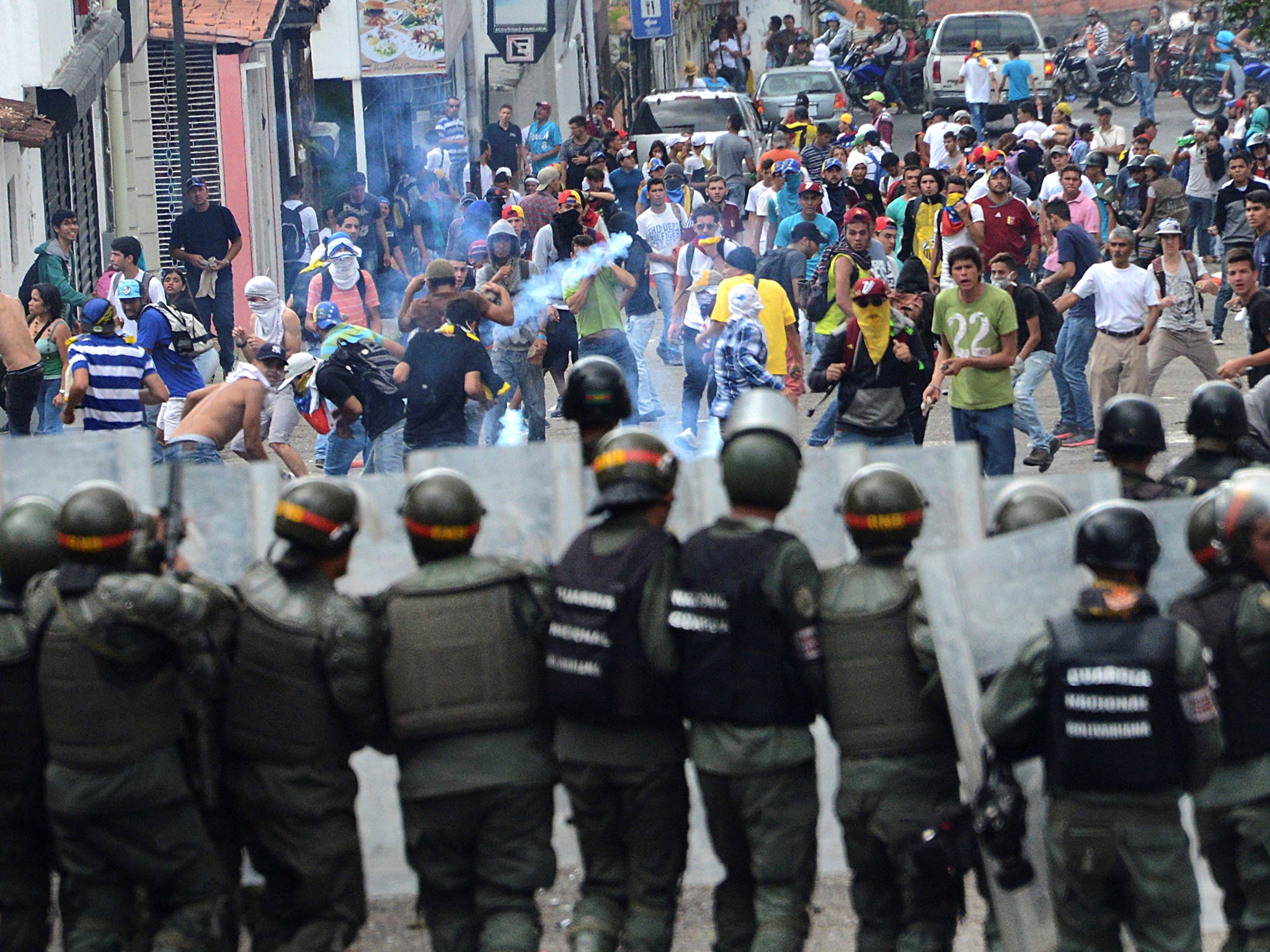 Demonstrators clash with members of Venezuelan National Guard during a rally in San Cristobal