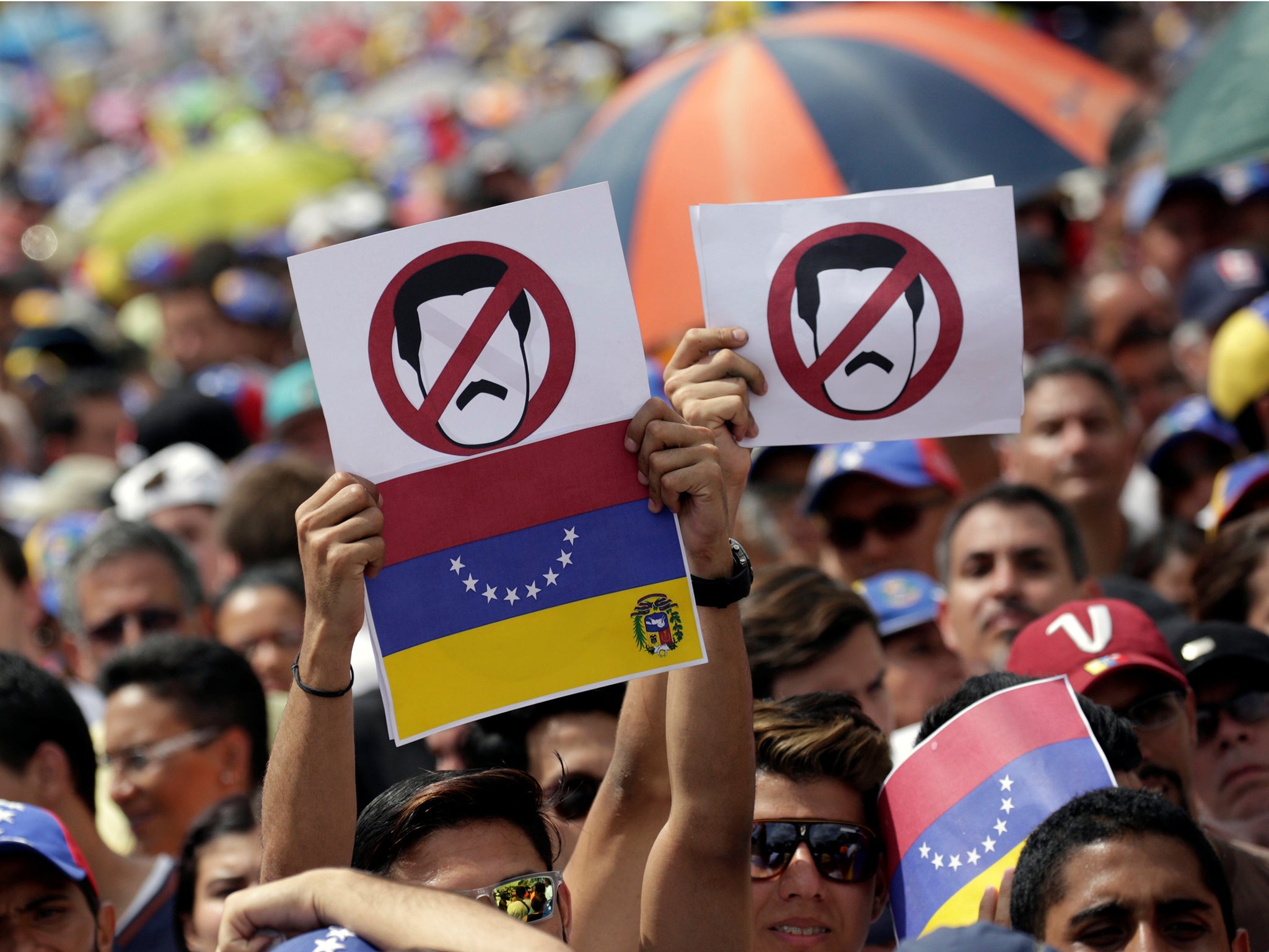 &#13;
Opposition supporters take part in a rally against Venezuela’s President Nicolas Maduro’s government in Caracas &#13;