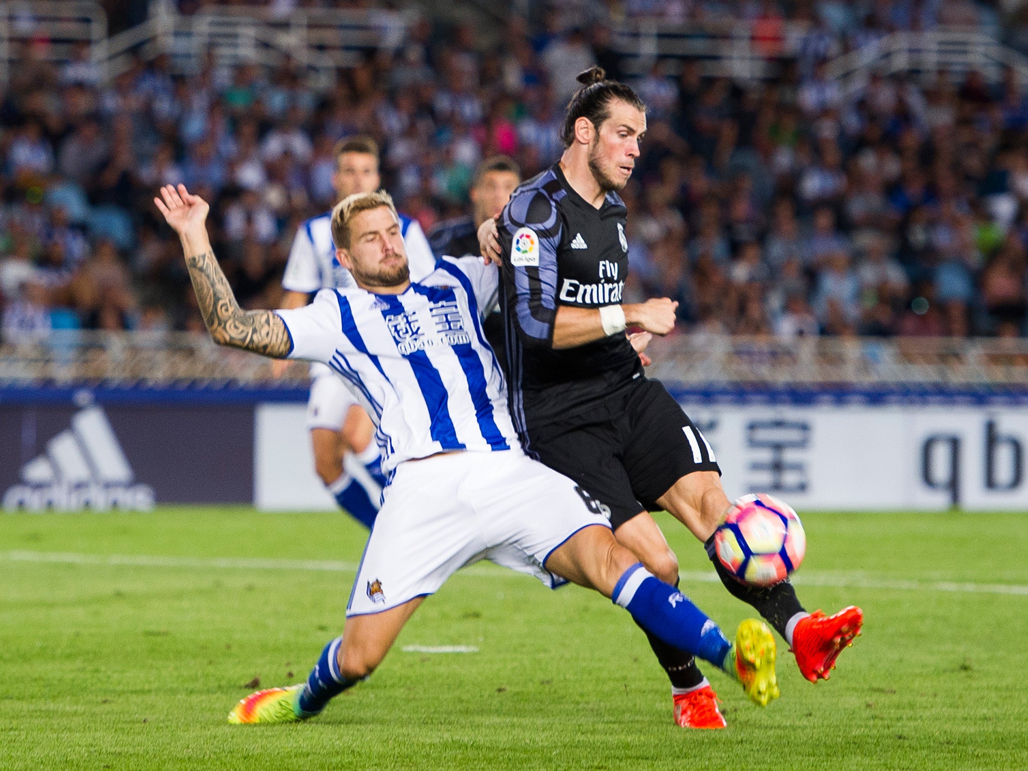 Real Sociedad's Inigo Martinez in action against Real Madrid's Gareth Bale