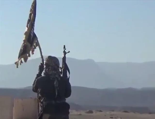 Video released by Isis purports to show militants raising a flag over the Somali port town of Qandala, in Puntland