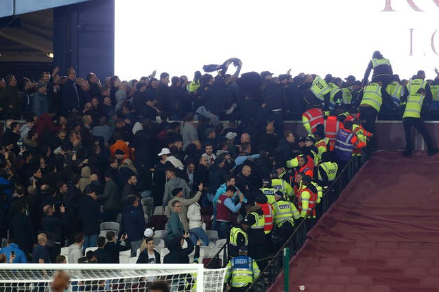 West Ham fans clash with Chelsea supporters while stewards try to separate them