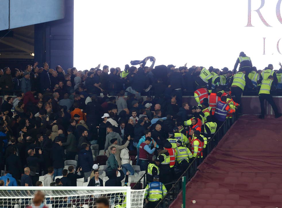 West Ham fans clash with Chelsea supporters while stewards try to separate them