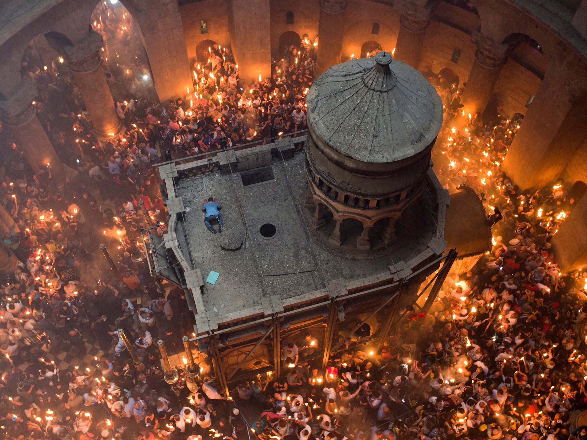 Worshippers celebrate the miracle of the Holy Fire at the Tomb of Christ in Jerusalem