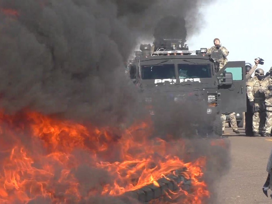 A roadblock is set alight during the protest