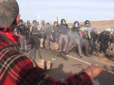 Riot police fire rubber bullets at North Dakota pipeline protest