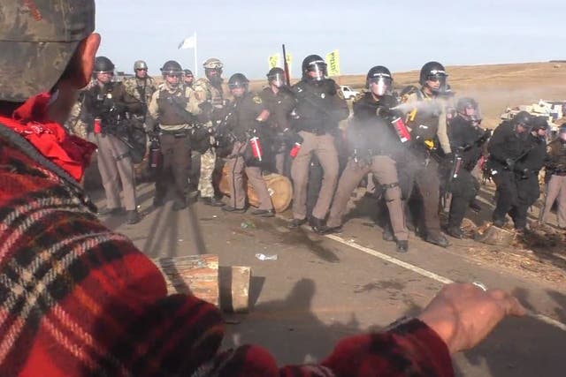 Police fire pepper spray at protesters during clashes over the North Dakota Pipeline on Thursday