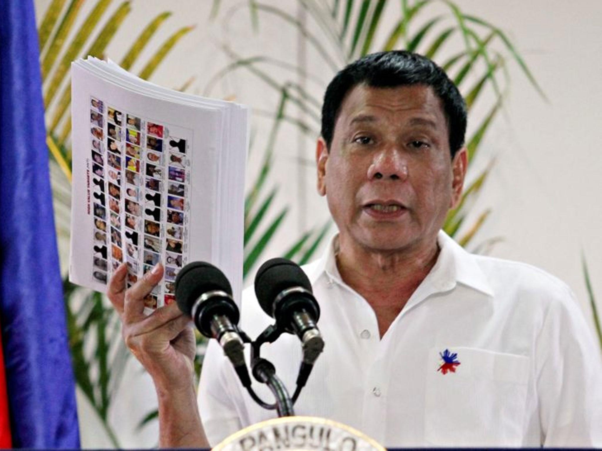 Philippine President Rodrigo Duterte shows the list of government, military and police officials involved in illegal drug trade