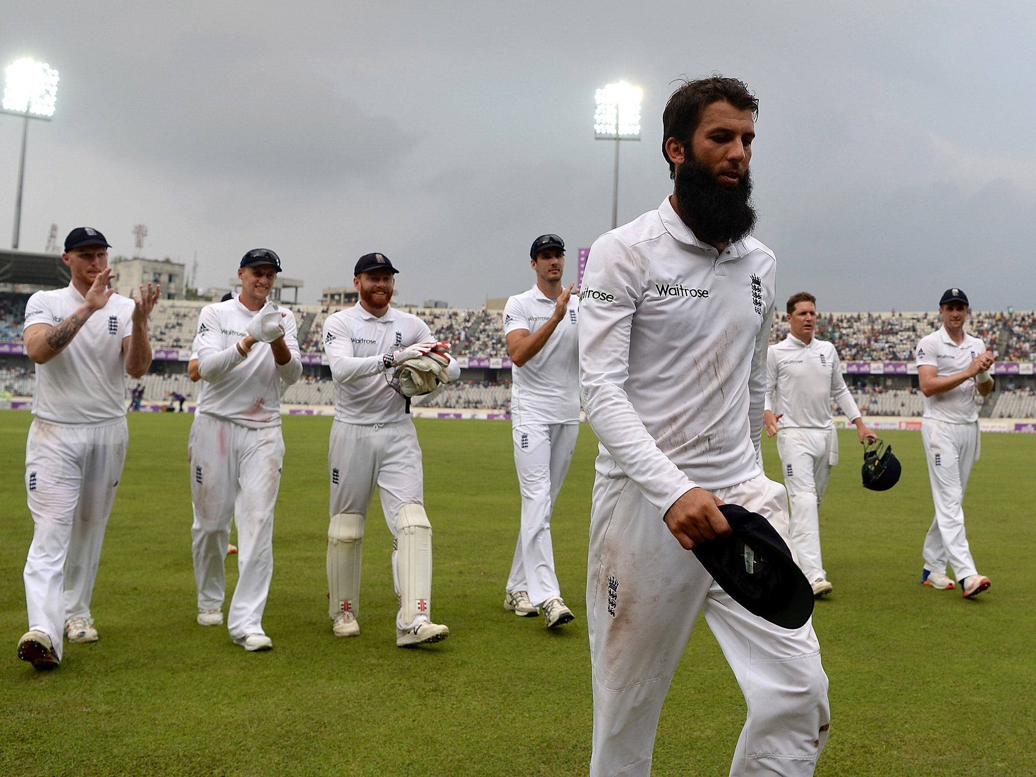 Moeen Ali takes the plaudits from his England teammates as they leave the field