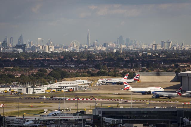 Aircraft at Heathrow Airport, with the London skyline in the background