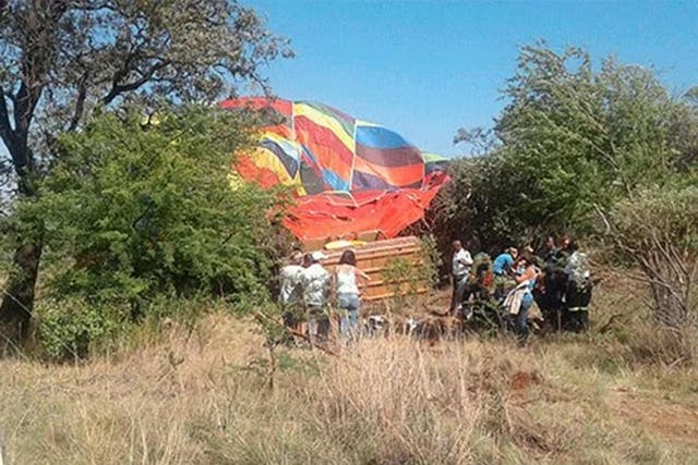 The balloon was reported to have crashed into rocks and a tree, seriously injuring three passengers
