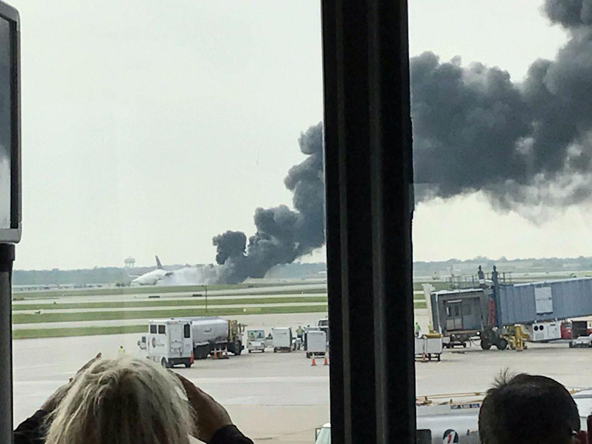 American Airlines plane catches fire at Chicago O&#39;Hare airport, leaving 8 injured | The Independent