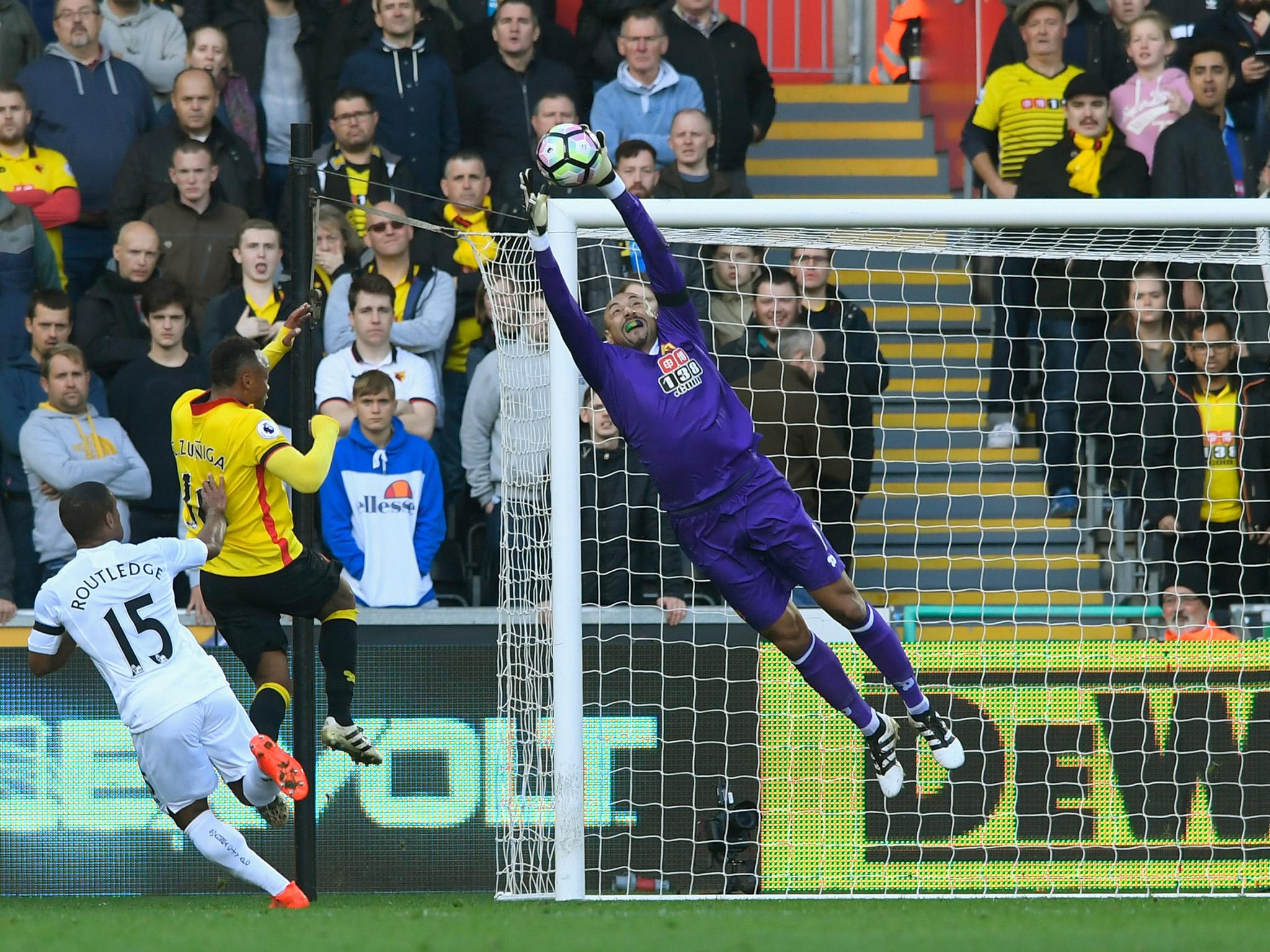 Watford goalkeeper Heurelho Gomes saves an effort from Wayne Routledge during the recent draw with Swansea