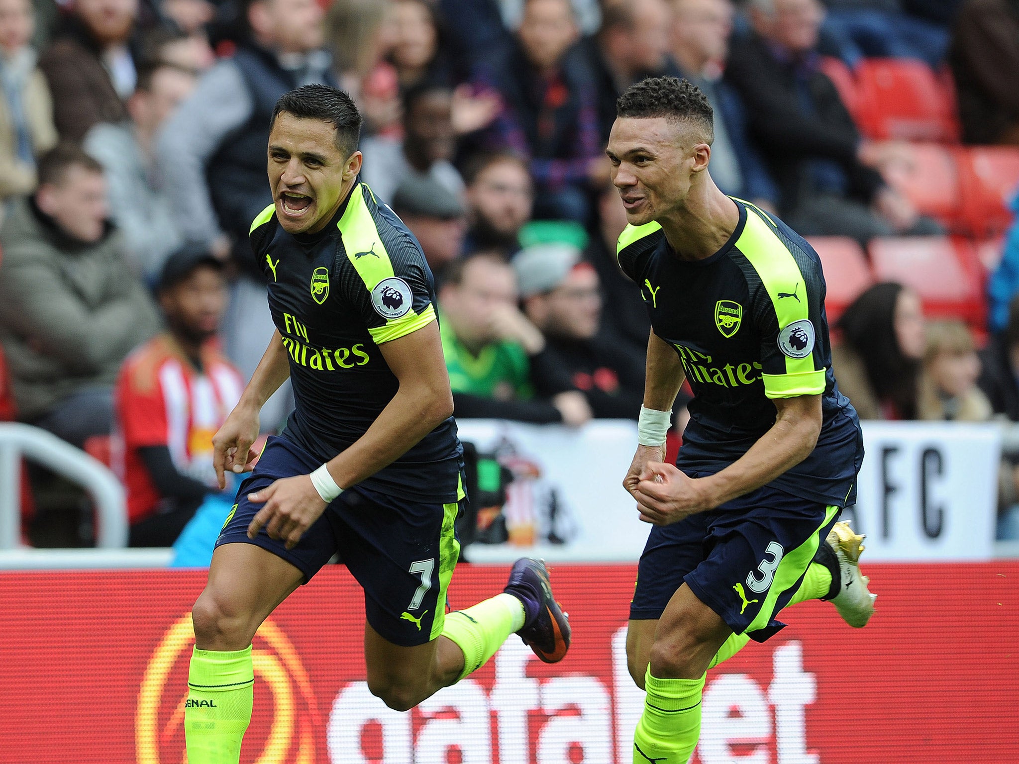 Alexis Sanchez peels away from Kieran Gibbs after scoring Arsenal's fourth goal
