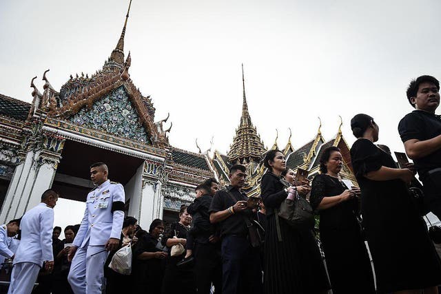 Thousands of Thais streamed into the gates of Bangkok's Grand Palace on Saturday as the public was granted its first chance to enter the throne hall where the body of late King Bhumibol Adulyadej is lying in state