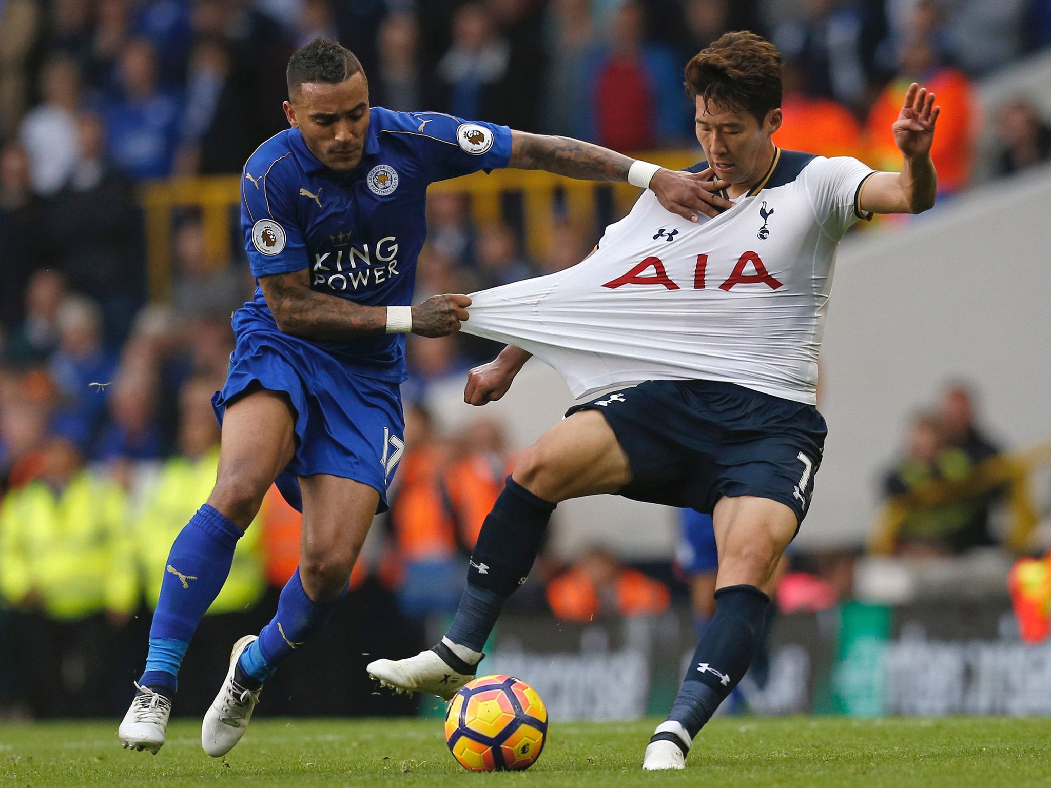 Danny Simpson grabs the shirt of Son Heung-min