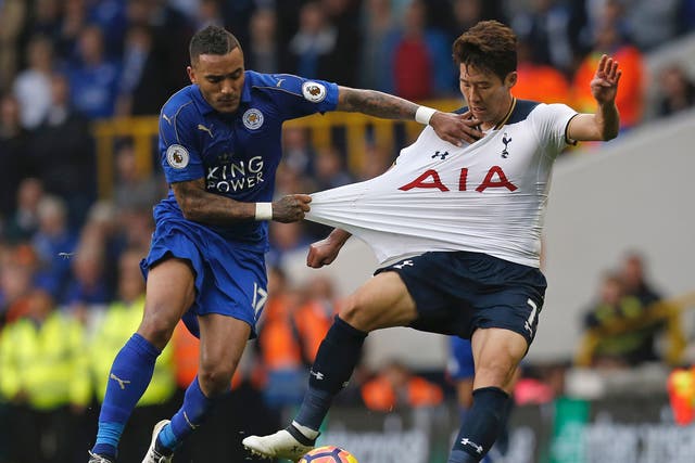 Danny Simpson grabs the shirt of Son Heung-min