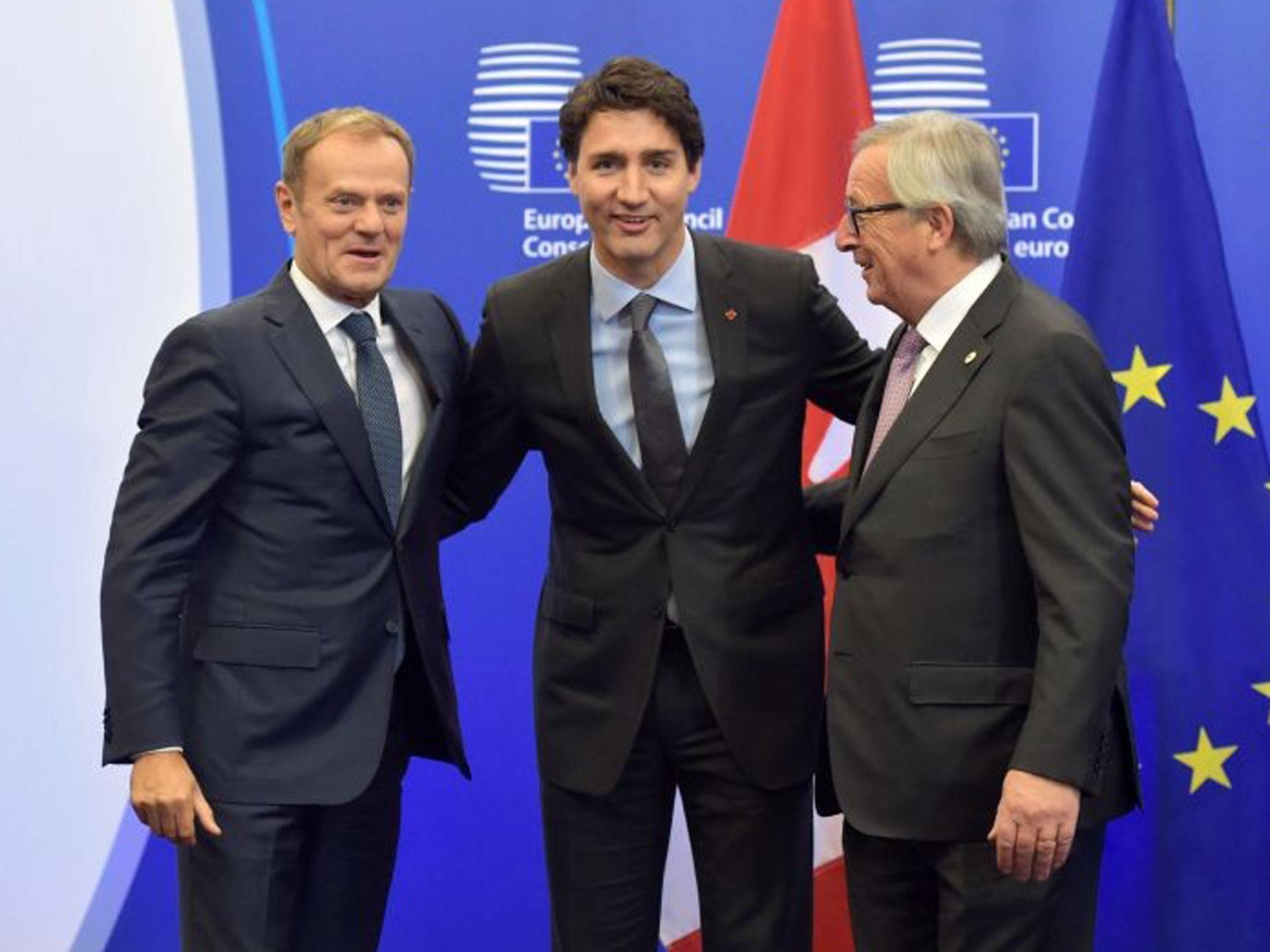 European Council President Donald Tusk, Canadian PM Justin Trudeau and European Commission President Jean-Claude Juncker before signing Ceta