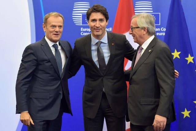 European Council President Donald Tusk, Canadian PM Justin Trudeau and European Commission President Jean-Claude Juncker before signing Ceta
