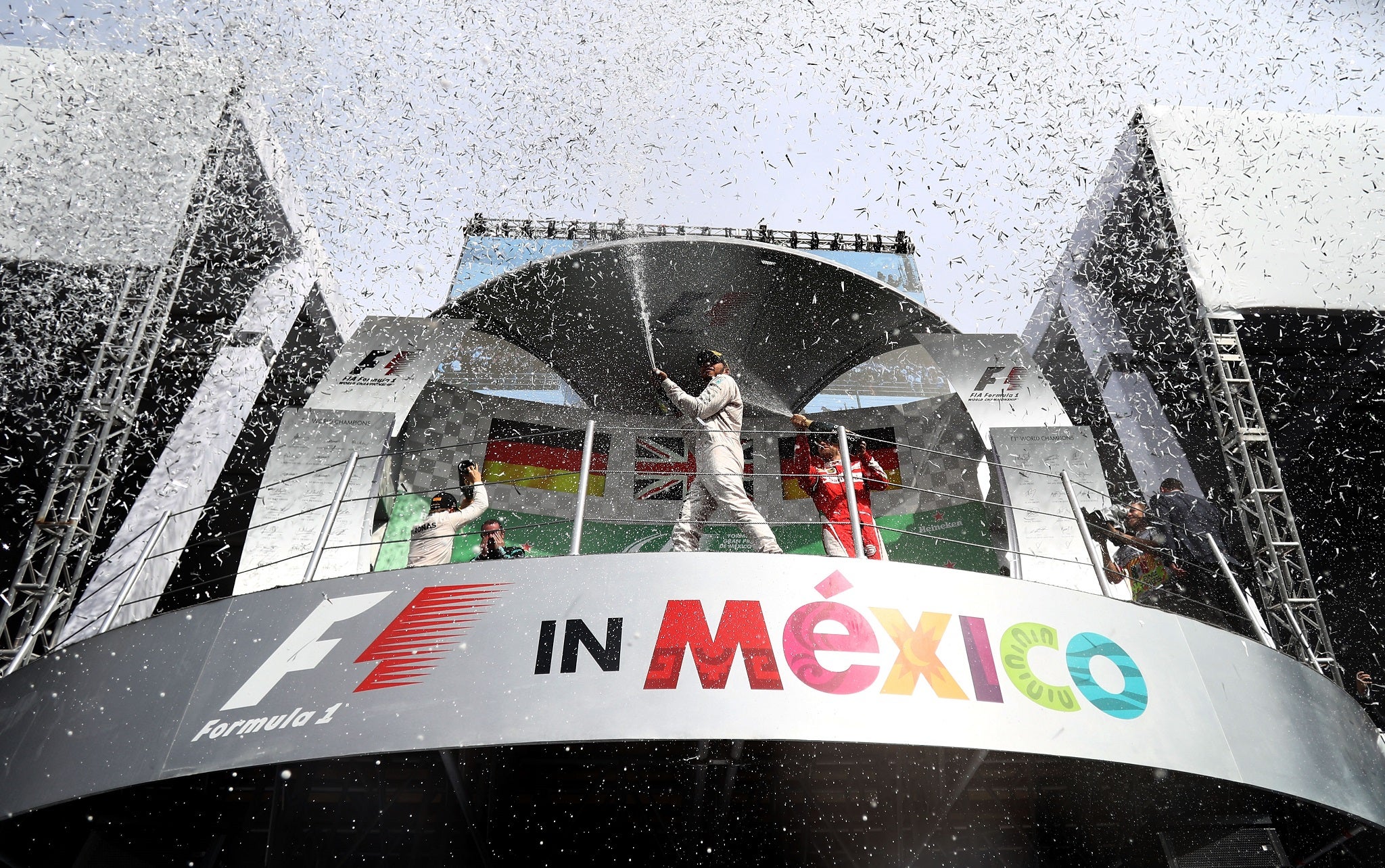 Hamilton, Rosberg and Vettel celebrate on the podium