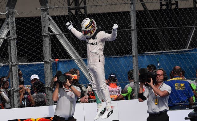 Lewis Hamilton celebrates winning the Mexico Grand Prix