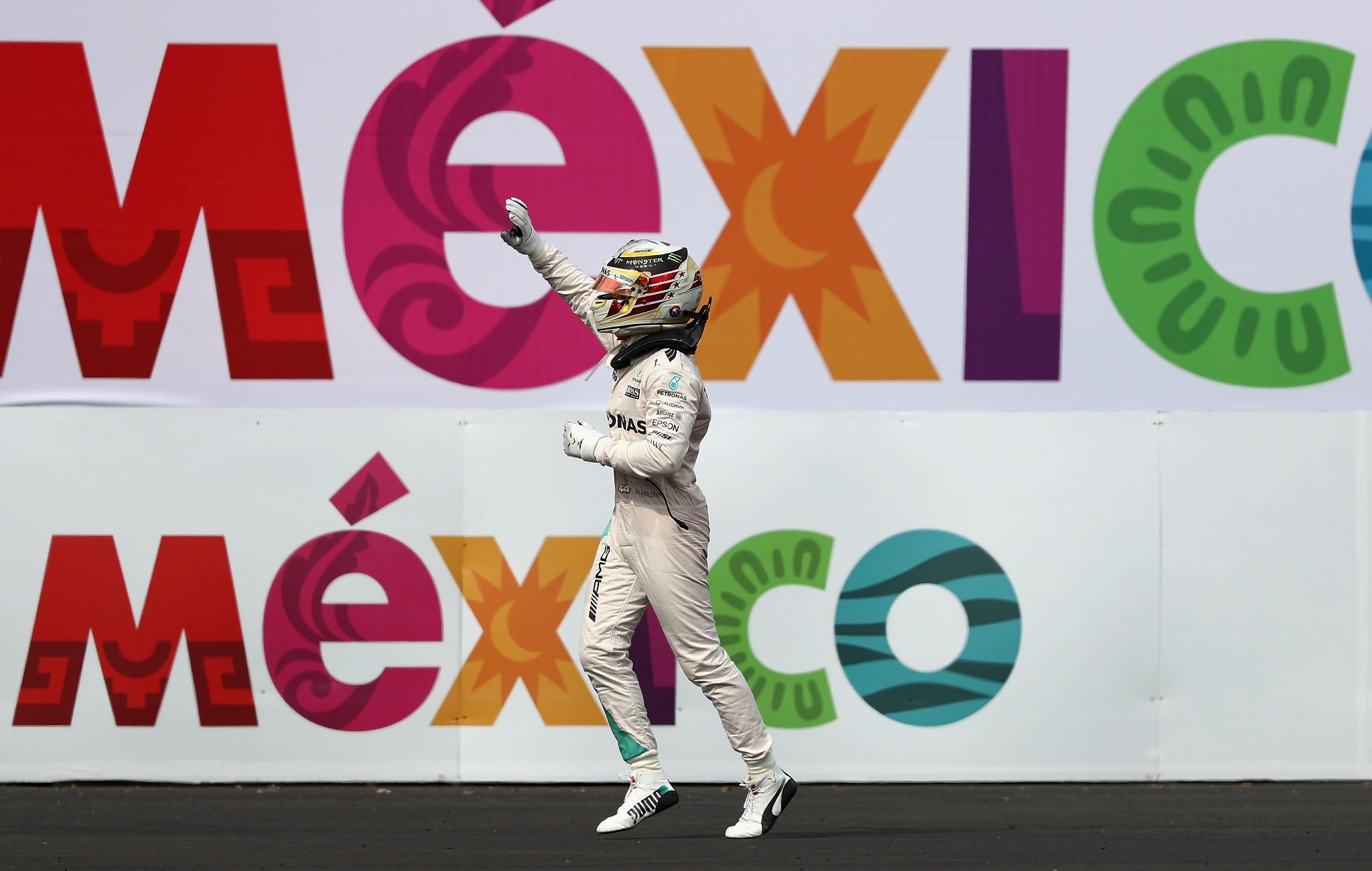 Hamilton celebrates winning the Mexico Grand Prix