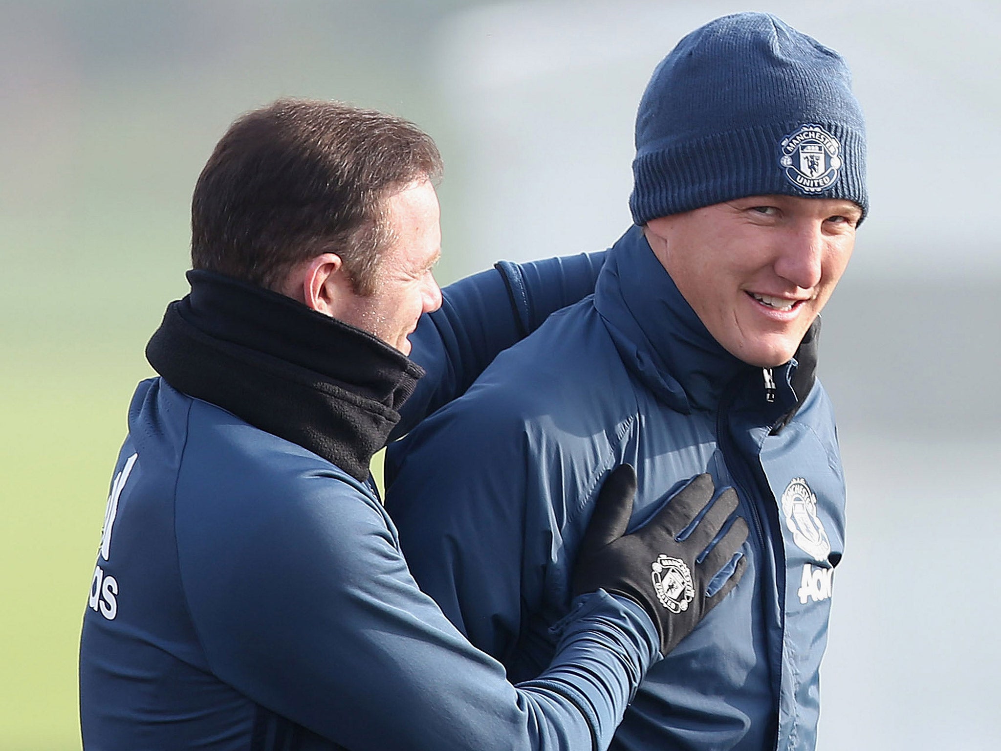 Wayne Rooney looked particularly happy to see Schweinsteiger back in training