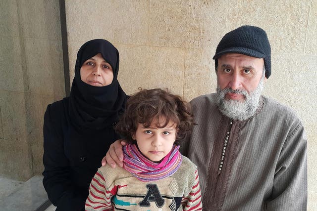 Kahled Kadoura, his wife Samira and 8-year old son Almuatazbilah in Aleppo shortly after they fled the east of the city