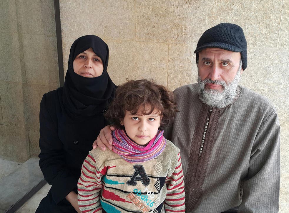 Kahled Kadoura, his wife Samira and 8-year old son Almuatazbilah in Aleppo shortly after they fled the east of the city