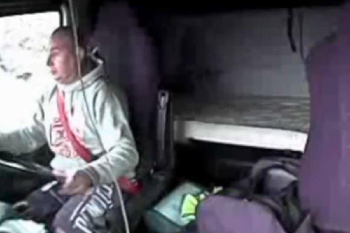 Moment lorry driver scrolling through music on mobile phone kills ...