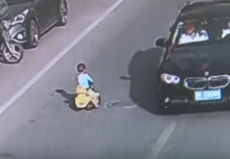 Boy riding toy car rescued from rush-hour traffic in China