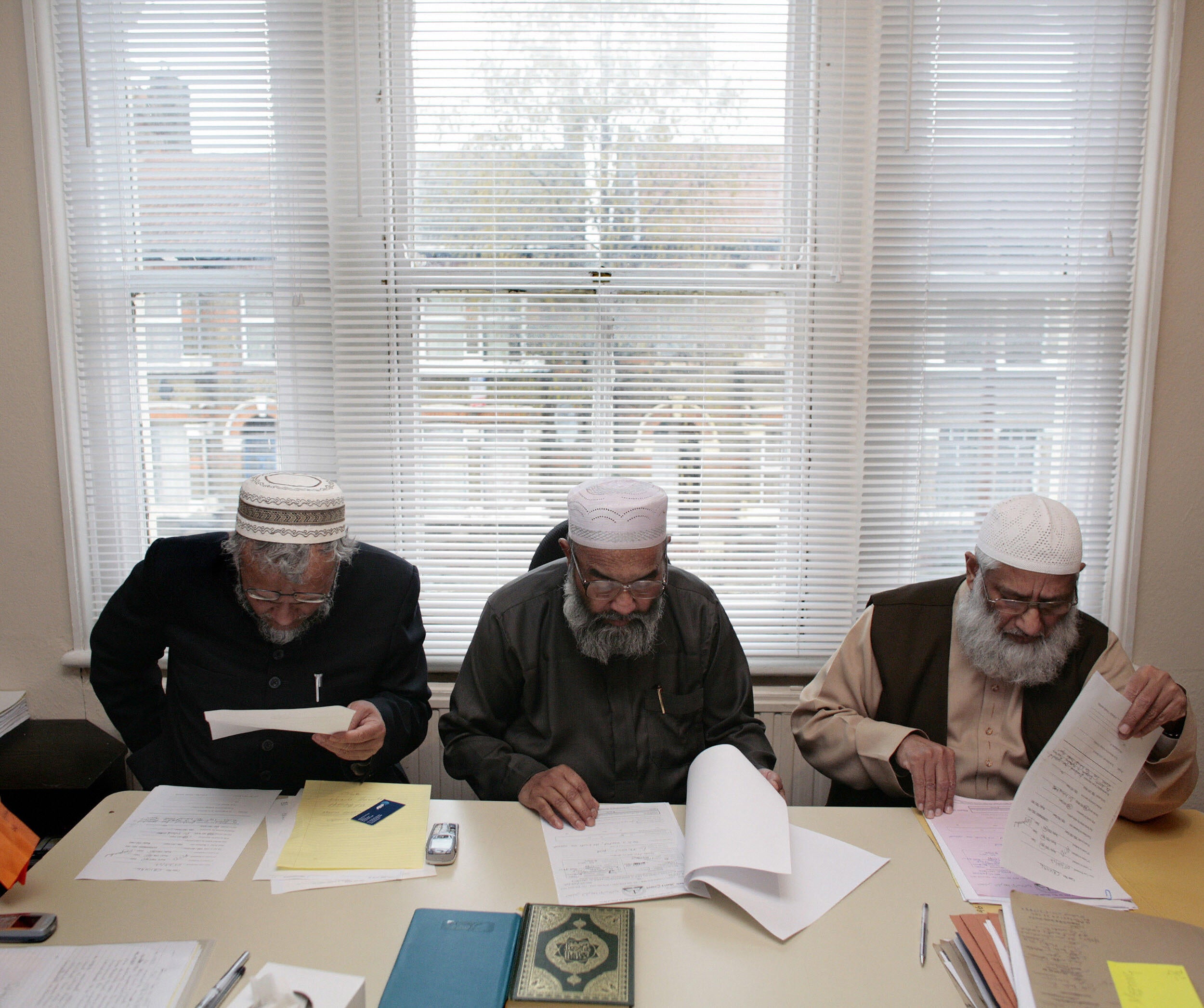 Dr Suhaib Hasan, Maulana Abu Sayeed and Mufti Barabatullah of the Sharia Council of Britain preside over marital cases at their east London headquarters