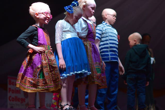 Children stand on stage during a pageant hosted by the Albinism Society of Kenya in Nairobi