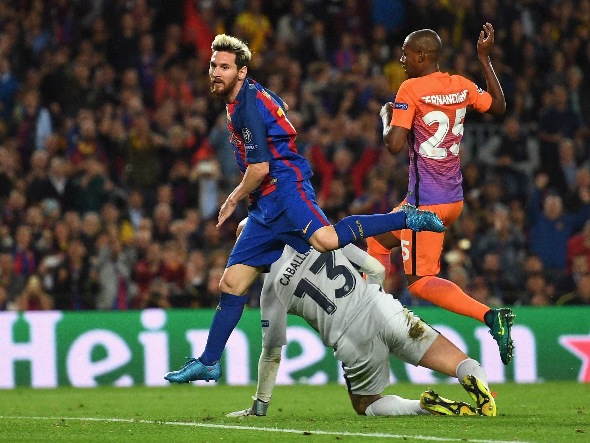 Lionel Messi scores against Manchester City in their clash with Barcelona at the Nou Camp