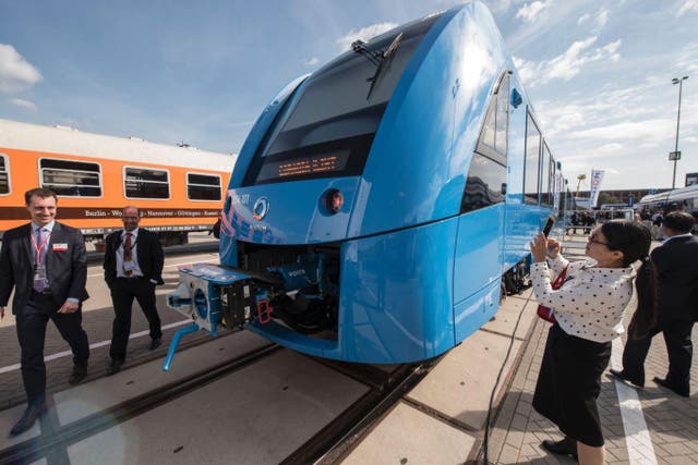 Visitors check out the Coradia iLint train, a CO2-emission-free regional train developed by French transport giant Alstom