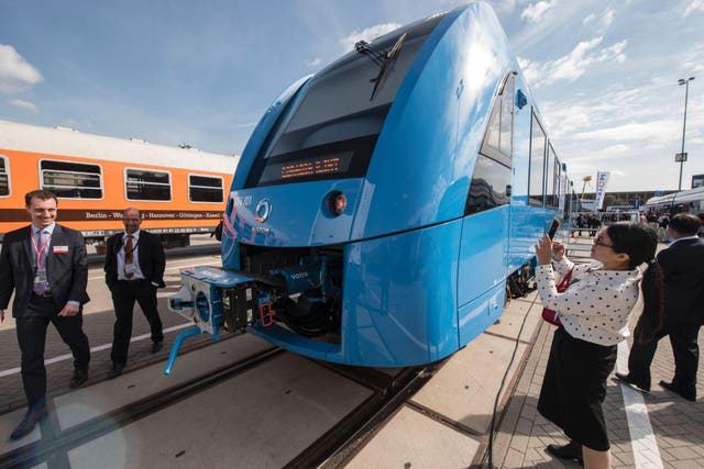 Visitors check out the Coradia iLint train, a CO2-emission-free regional train developed by French transport giant Alstom